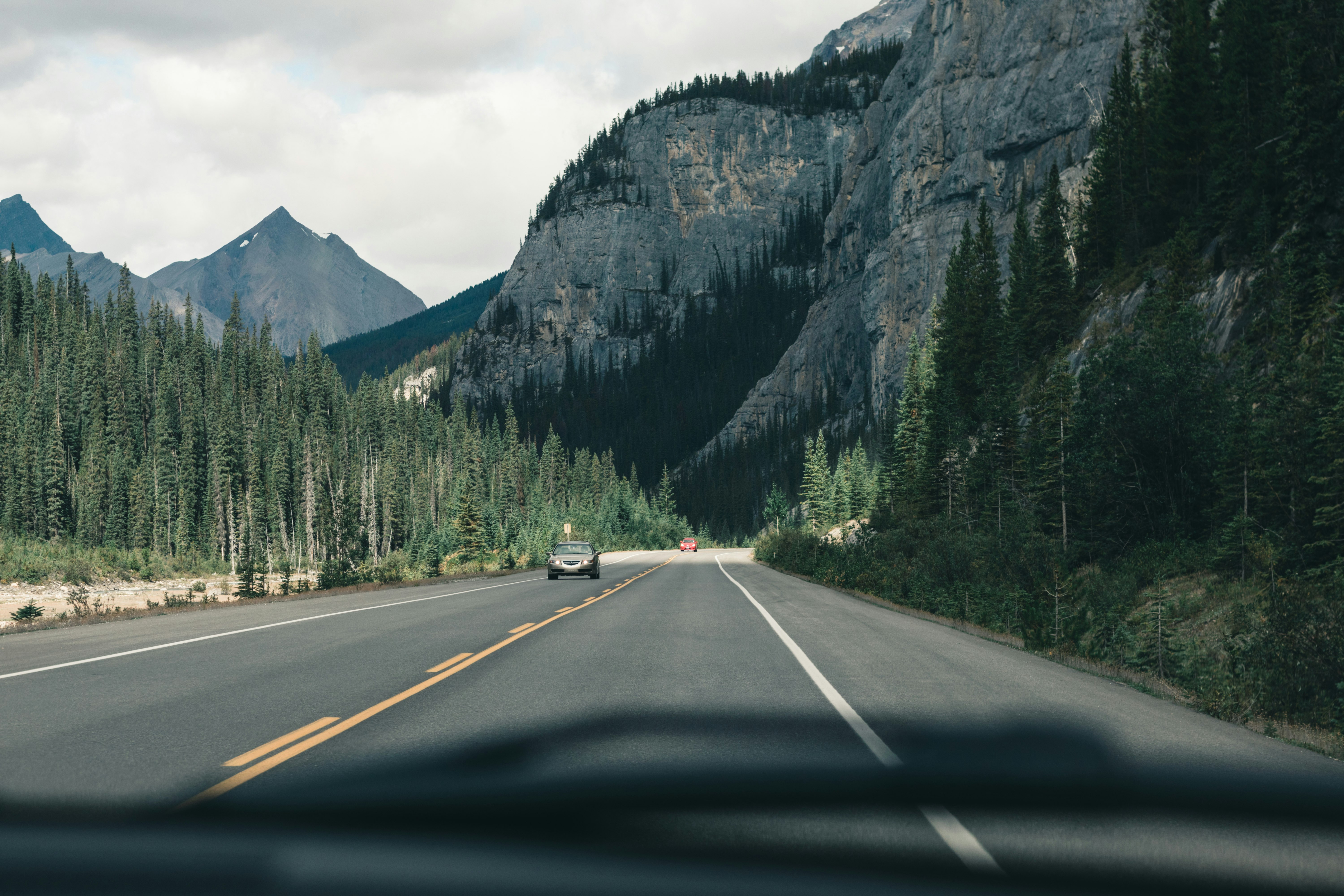 gray car on road near mountain during daytime